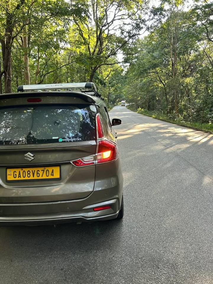 Rear view of Ertiga cab with WhatsApp contact 9689035783